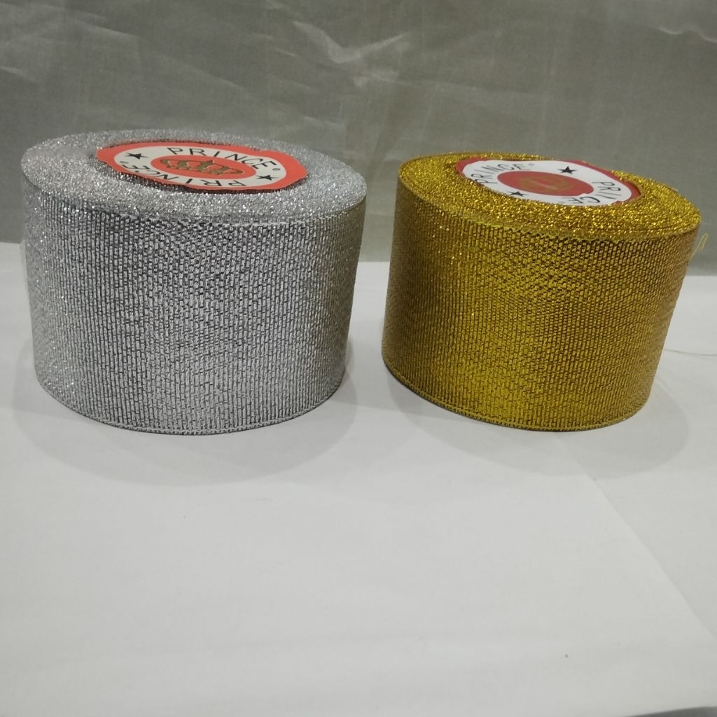 

pita mas/perak 2 inch (lebar 5 cm)isi 20 yard