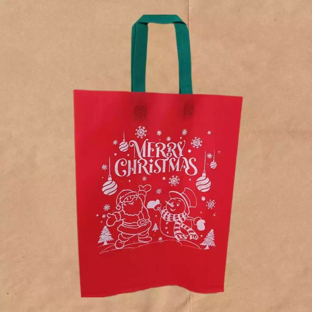 

GH - Goodie Bag Handle Edisi Merry Christmas uk 30x40x8 Tas Spunbond Natal