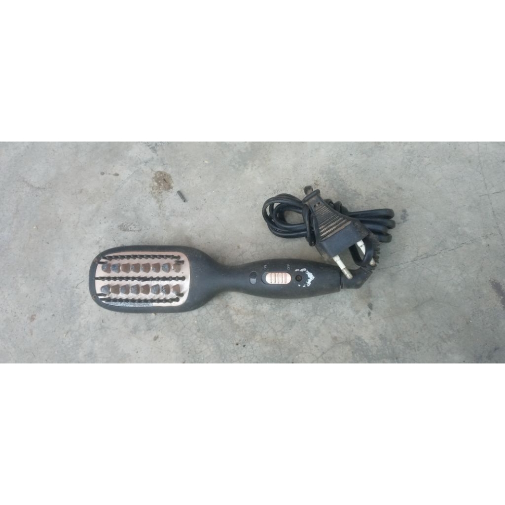 sisir pelurus rambut elektrik