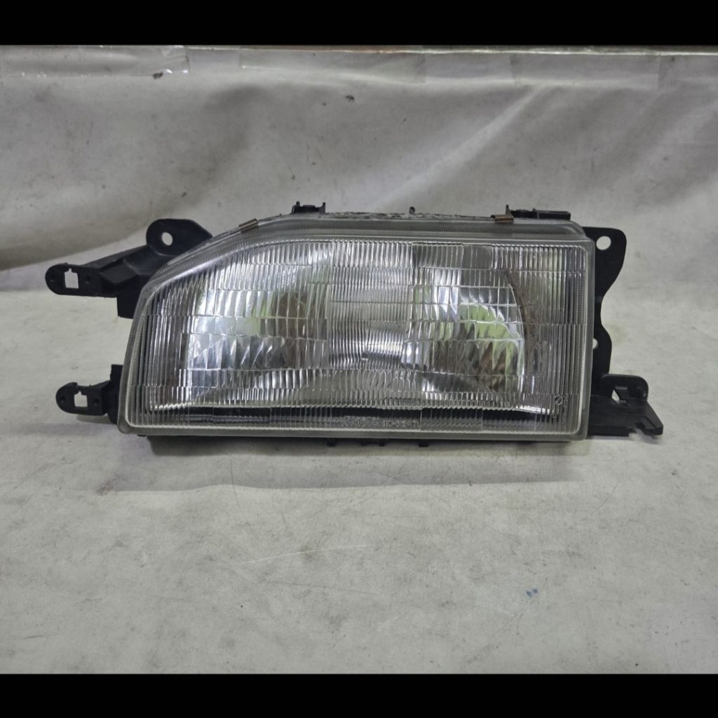 Headlamp kiri mazda 323 1988 1989 original koito