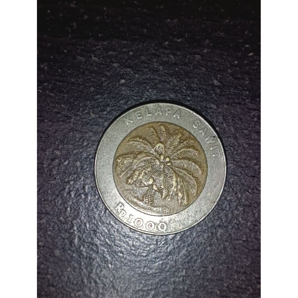 uang kuno Rp.1000 kelapa sawit 1995)