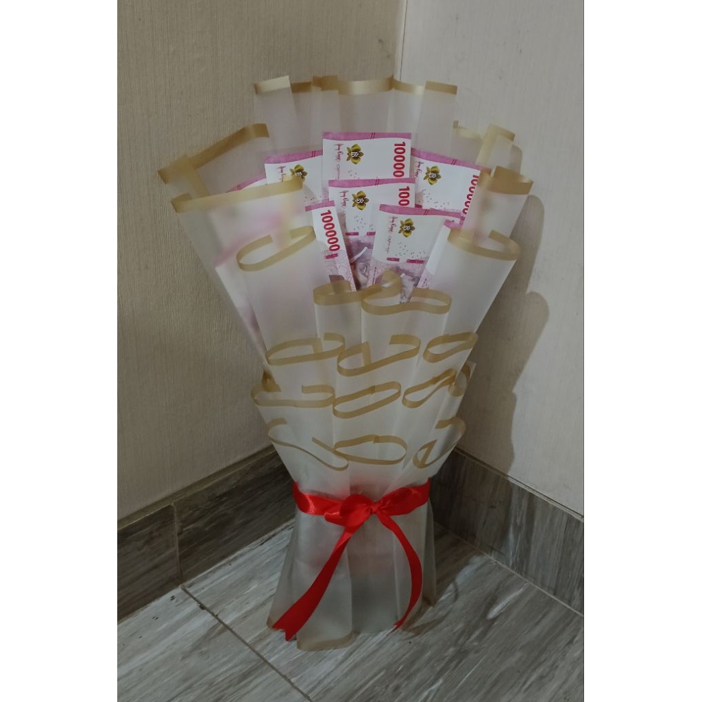 Buoquet uang mainan seratus ribuan