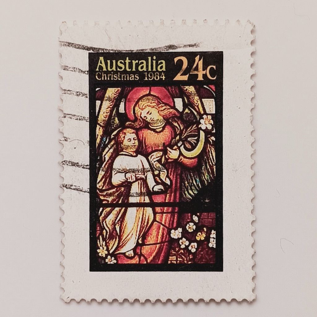 

(AD) Perangko Australia Christmas 1984 - Angel with Child, Holy Trinity Church, Sydney 24 cent Used