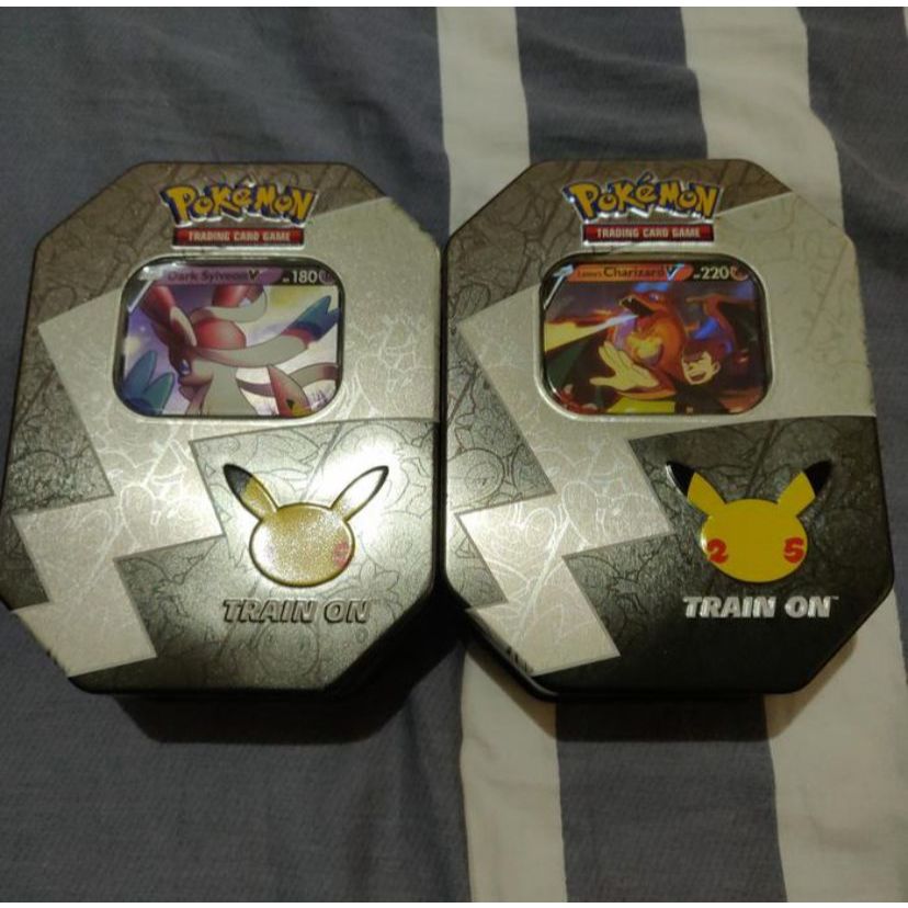 Pokemon TCG EN Celebration Lance's Charizard V & Dark Sylveon w/ Tins