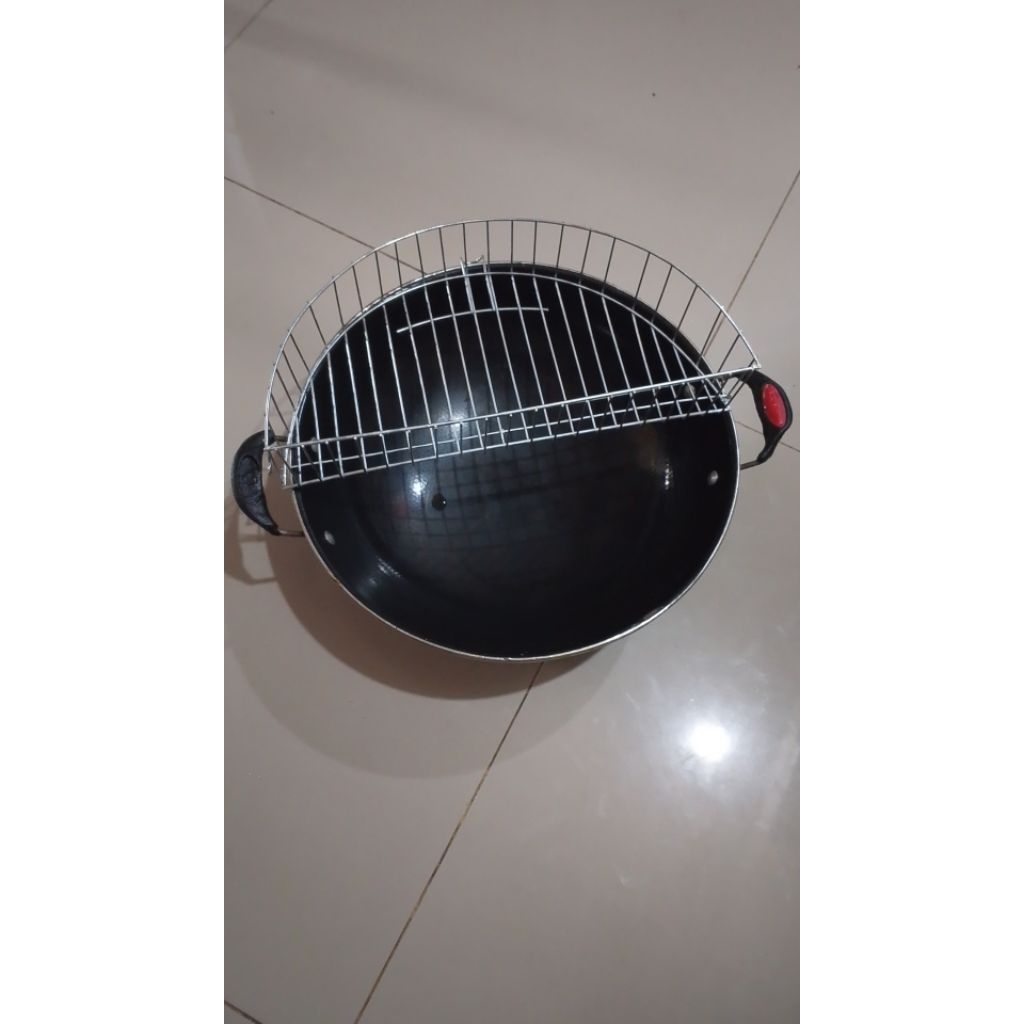 peniris gorengan/tirisan minyak pada penggorengan