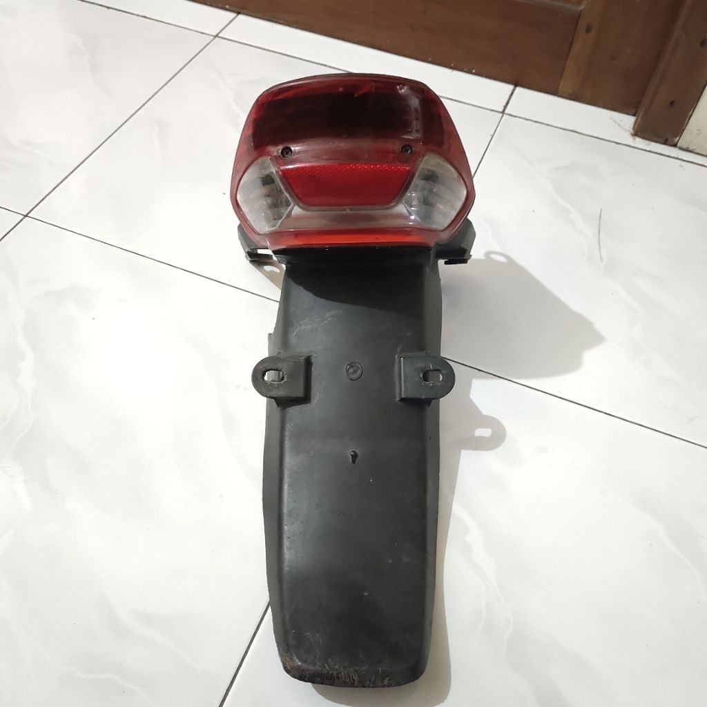 slebor lampu belakang Honda Kirana 125 original