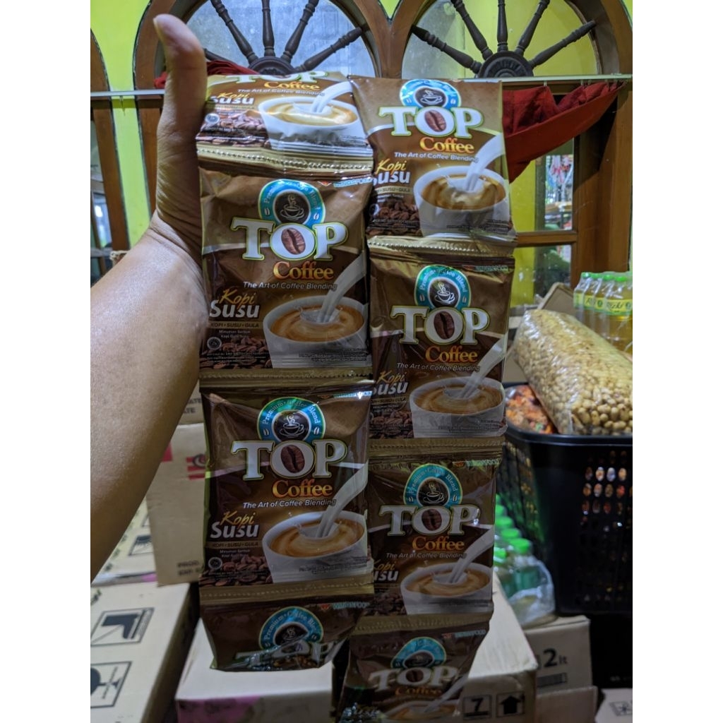 

Top Coffee kopi + susu 1renceng isi 12 sachet
