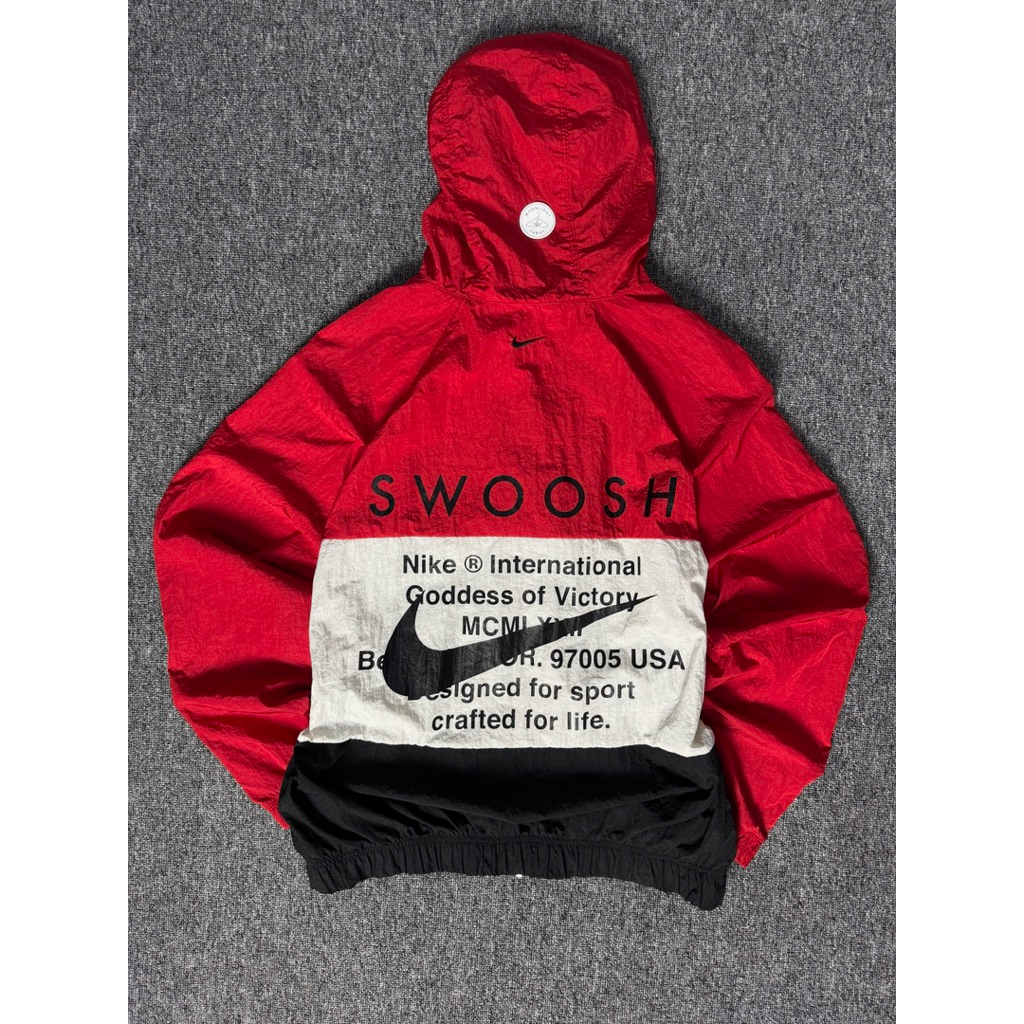 NIKE INTERNATIONAL DOUBLE SWOOSH WOVEN WINDBREAKER