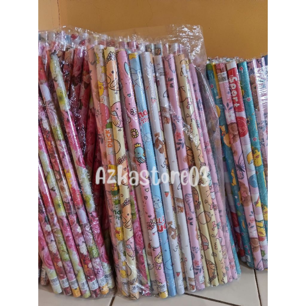 

Kertas Kado Kiky Sudah Di Gulung Motif Remaja/Anak