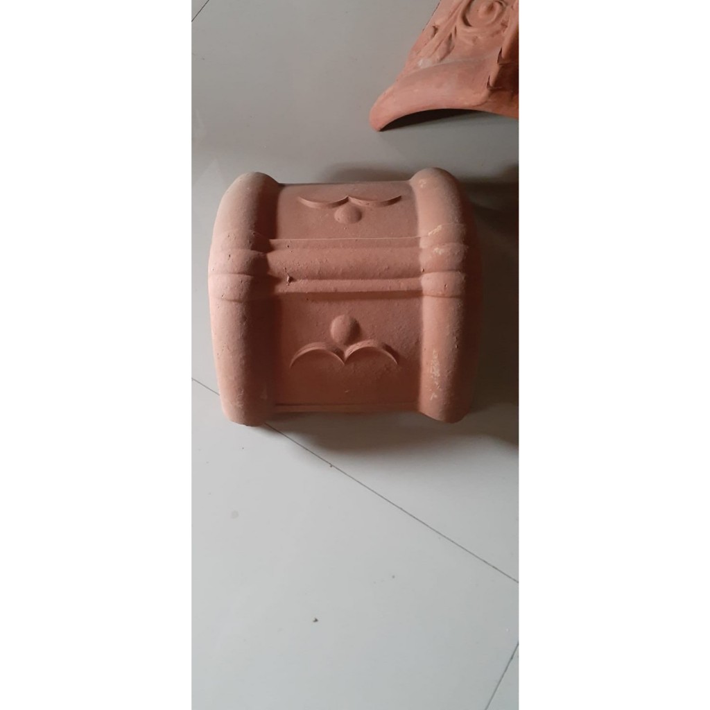 sambungan tengah buat wuwung atau kerpus kecil