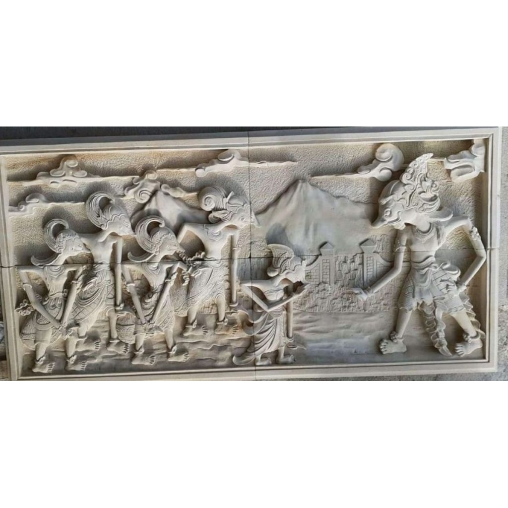 relief batu paras motif wayang