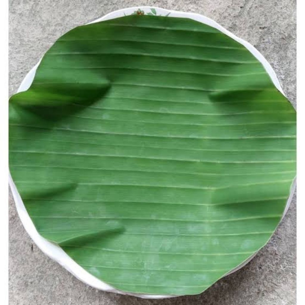 

daun pisang bulat fresh pengganti kertas nasi 500 per lembar