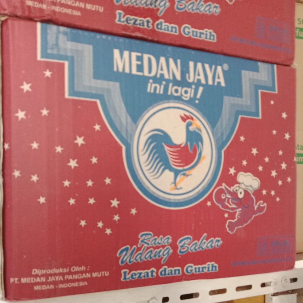 

Snack cemilan -pilus Medan jaya rasa udang bakar 1 Dus ( 6gx20 bgks)