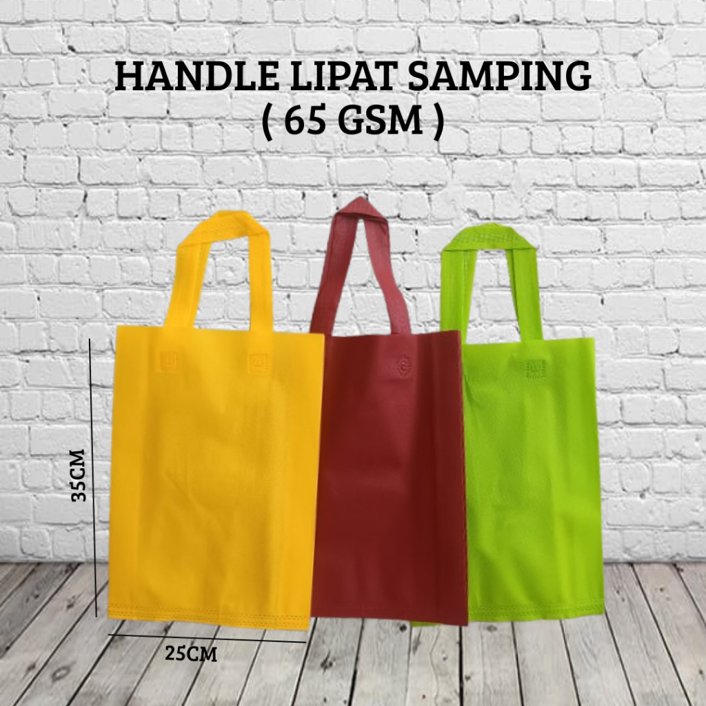 

Tas Spunbond handle lipat samping Ukuran 25x35 ( Isi 12pcs ) Goodie Bag Hamers 65Gsm
