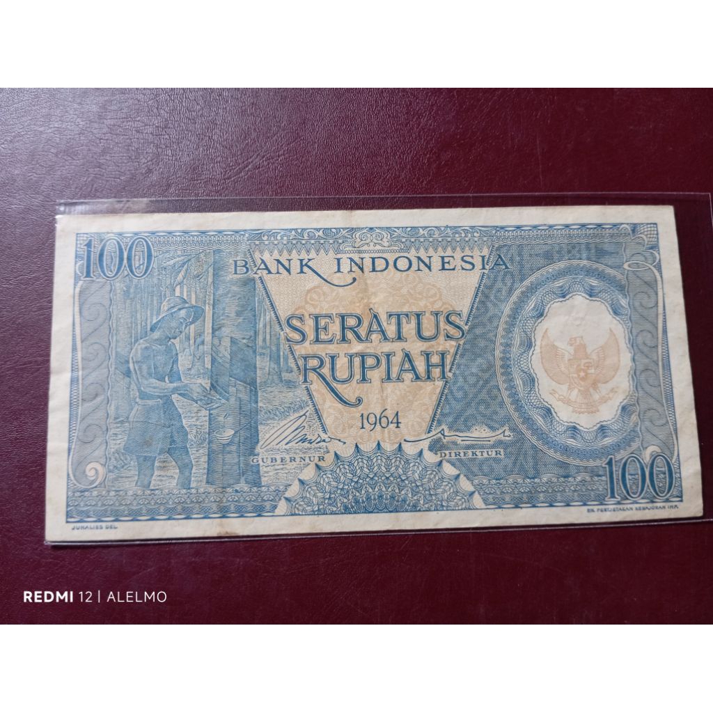 100 rupiah uang kertas pekerja biru tahun 1964 bekas asli