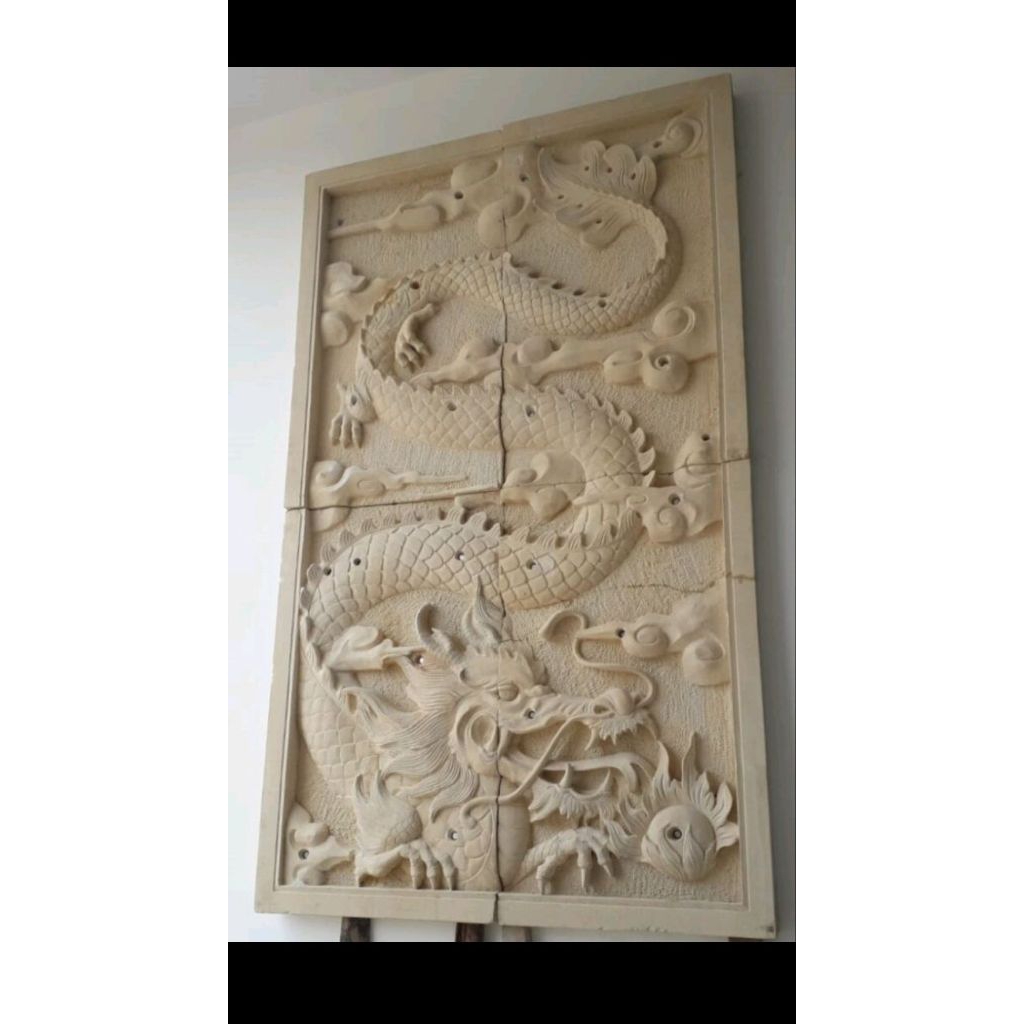relief ukir batu alam motif naga