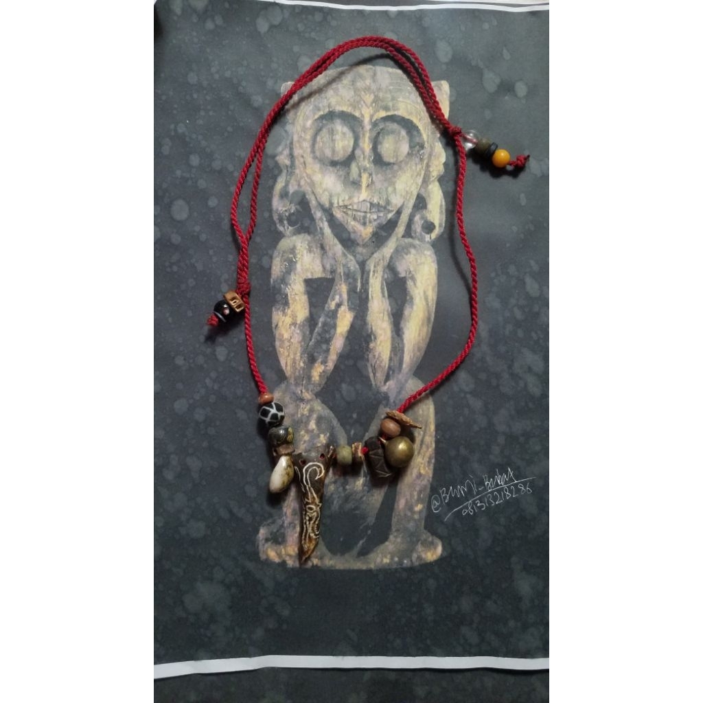 kalung etnik ukiran tulang manik