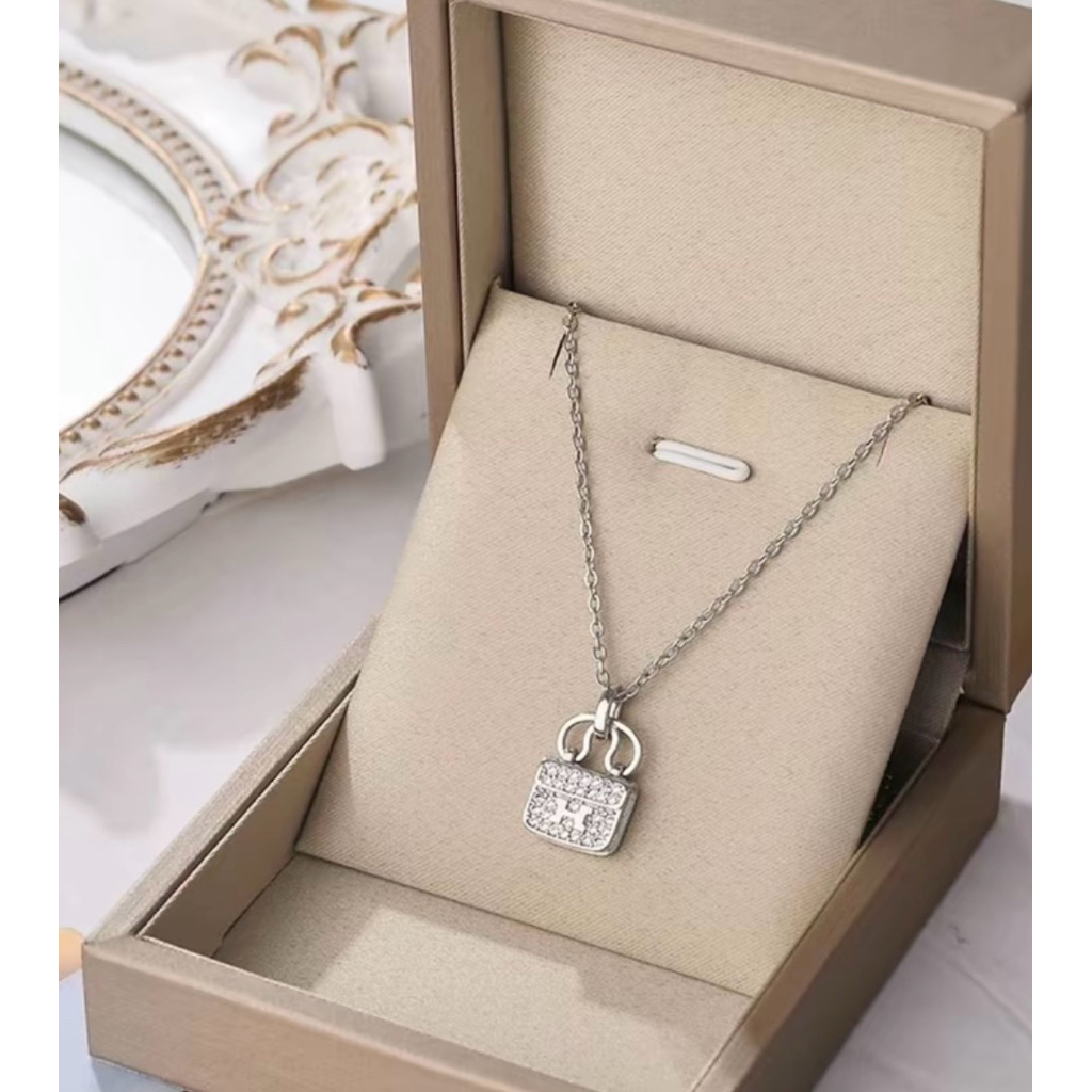 Kalung liontin tas titanium