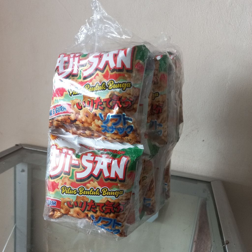 

Aji-San Ajisan 1 Pack Isi 10pcs @15g Pilus Bentuk Bunga Makanan Snack Jajanan Cemilan Ringan Jadul Enak Gurih Renyah Legend Halal BPOM