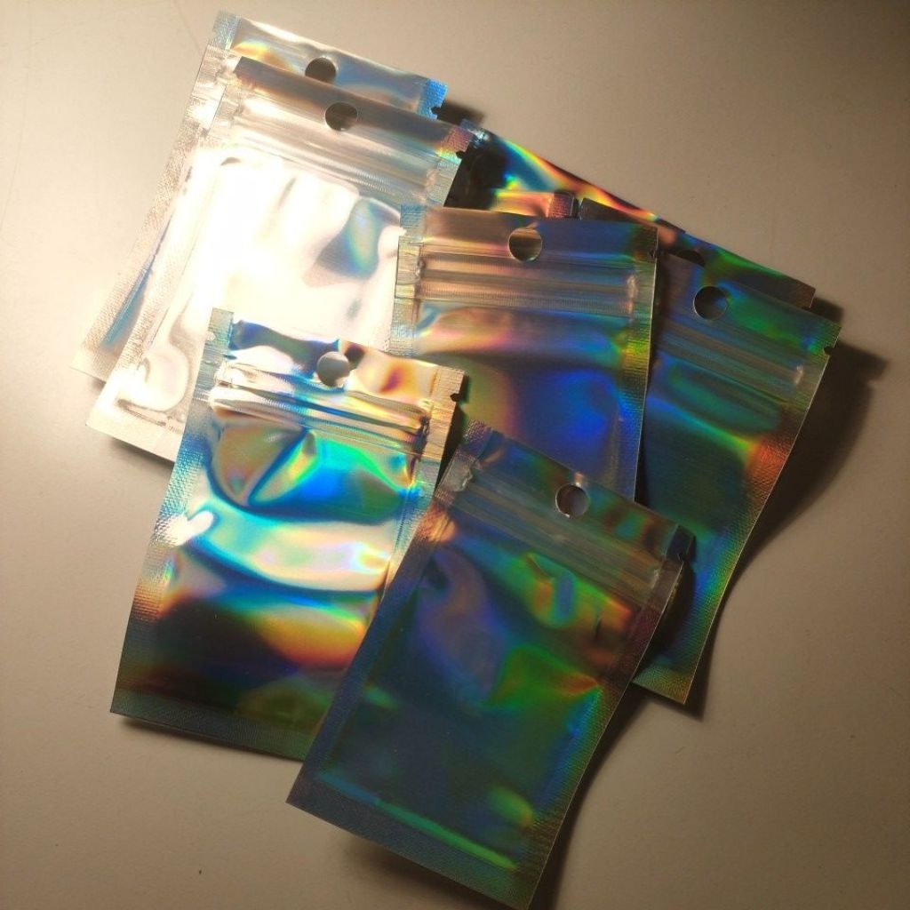 

Plastik Holo packing ( 9x5 )