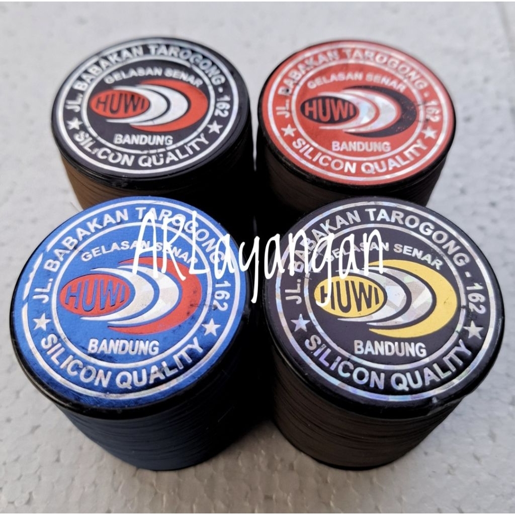 Gelasan Huwi Label Hitam/Merah/Biru 2024