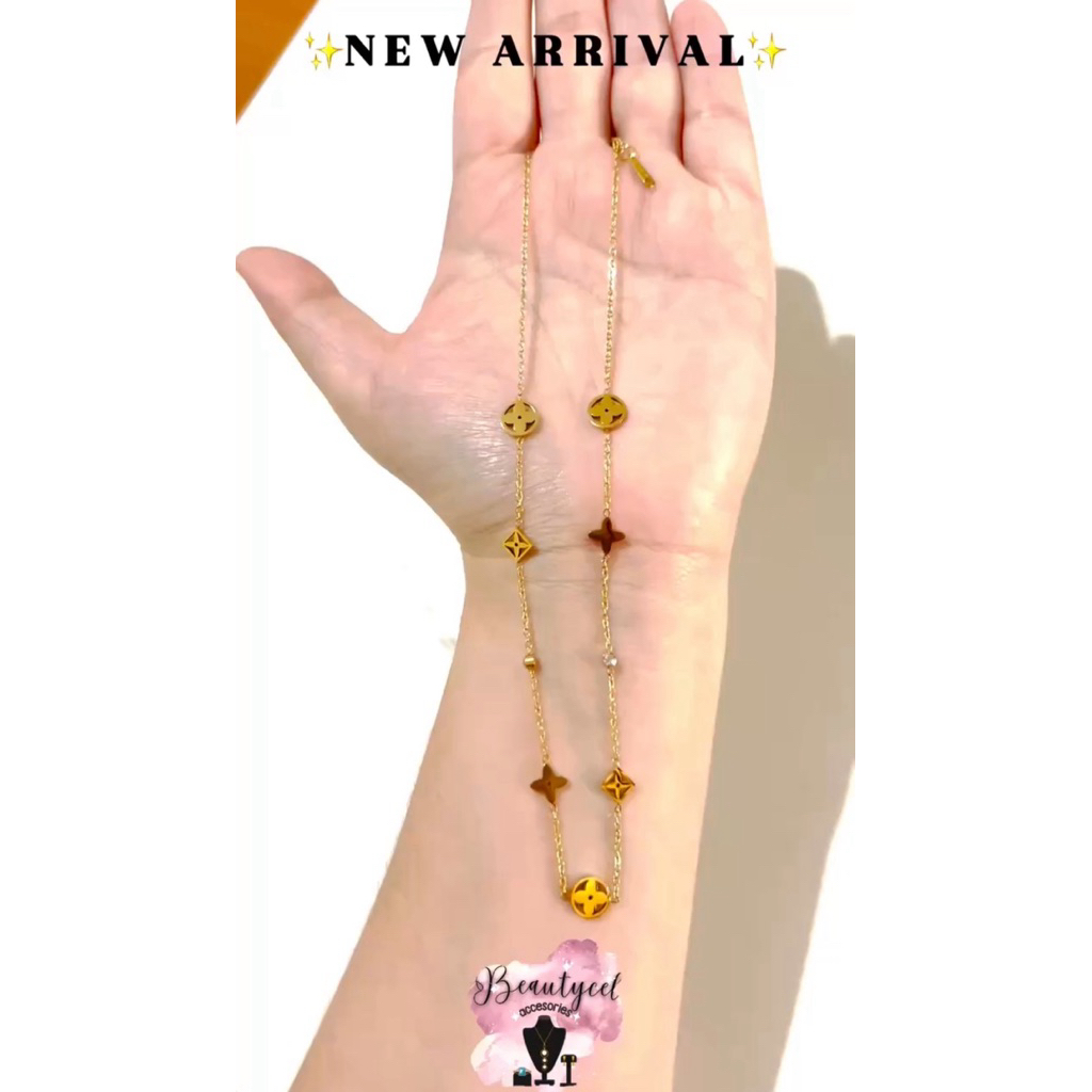 Kalung titanium gold bandul bintang bunga