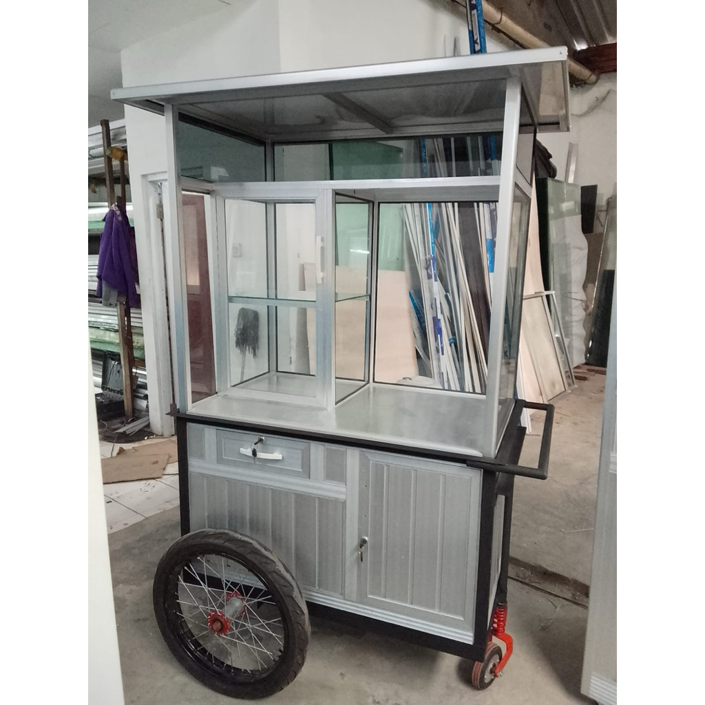 Gerobak/ Lemari Jualan Aluminium Standard dengan ukuran P.100 L.60 T.180 Roda Motor Warna Silver Ata