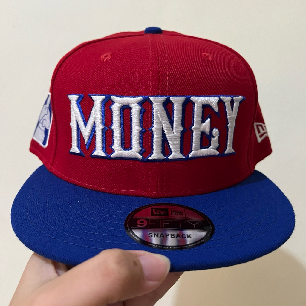 Topi New Era MONEY Script Merah Biru Snapback