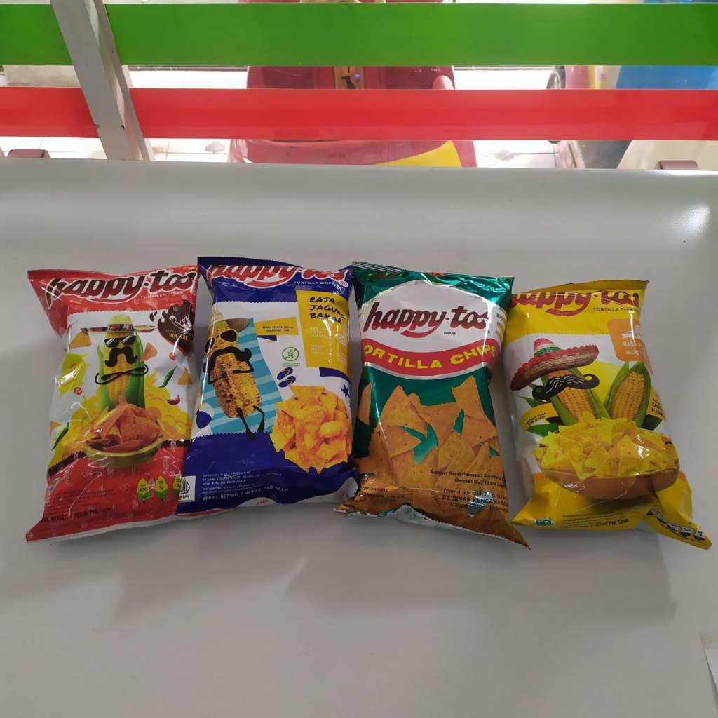 

Hapy Tos Tortilla Chips dari Dua Kelinci 140 gram