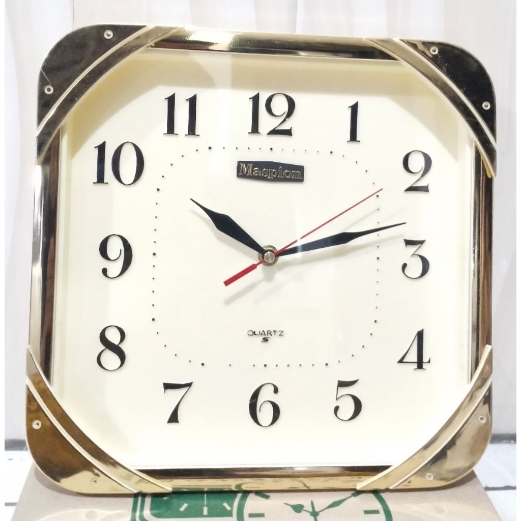JAM DINDING Merk MASPION warna gold.