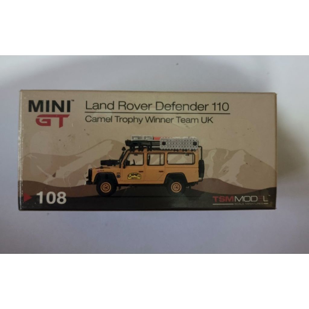 MINI GT LAND ROVER DEFENDER 110 CAMEL TROPHY WINNER TEAM UK