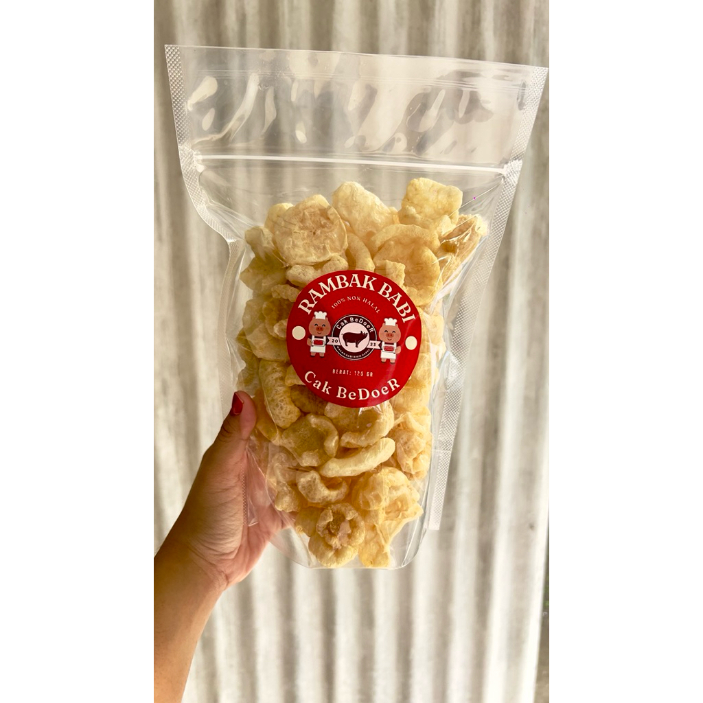 

Kerupuk Kulit Babi / KERUBI / Kerupuk B2 / RAMBAK BABI Cak Bedoer - 100gram Pouch