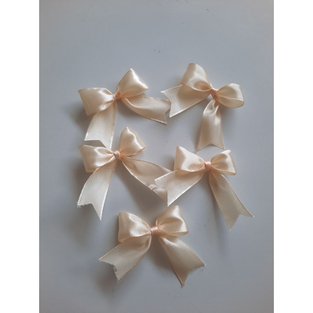 

Pita hiasan sovenir satin 100 pcs warna krem