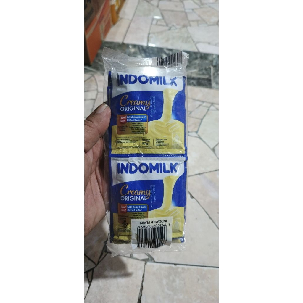 

Susu indomilk putih sachet per pack isi 6 pcs