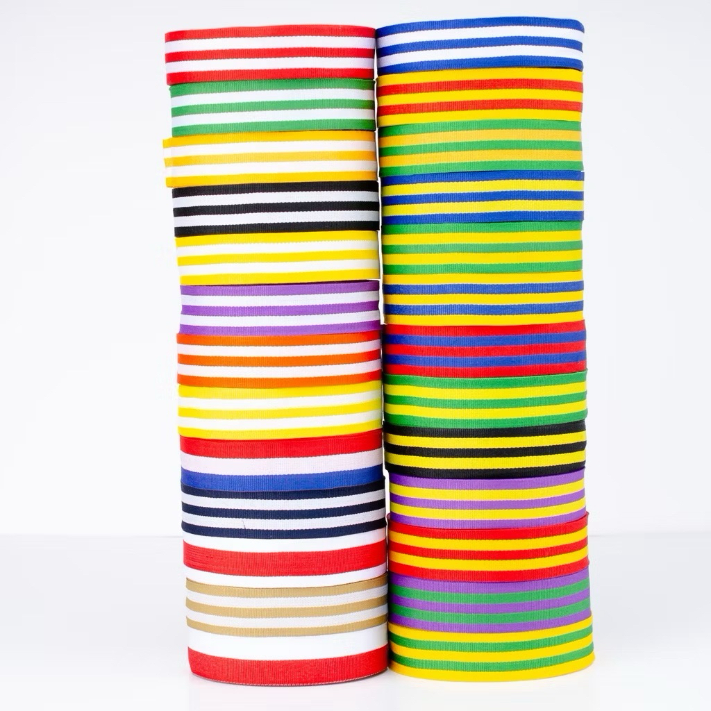 

PITA MEDALI/TALI MEDALI MERAH PUTIH / WARNA WARNI UNTUK PIAGAM/ TROPHY/ PIALA - LEBAR 3CM (PER ROLL ±25M)