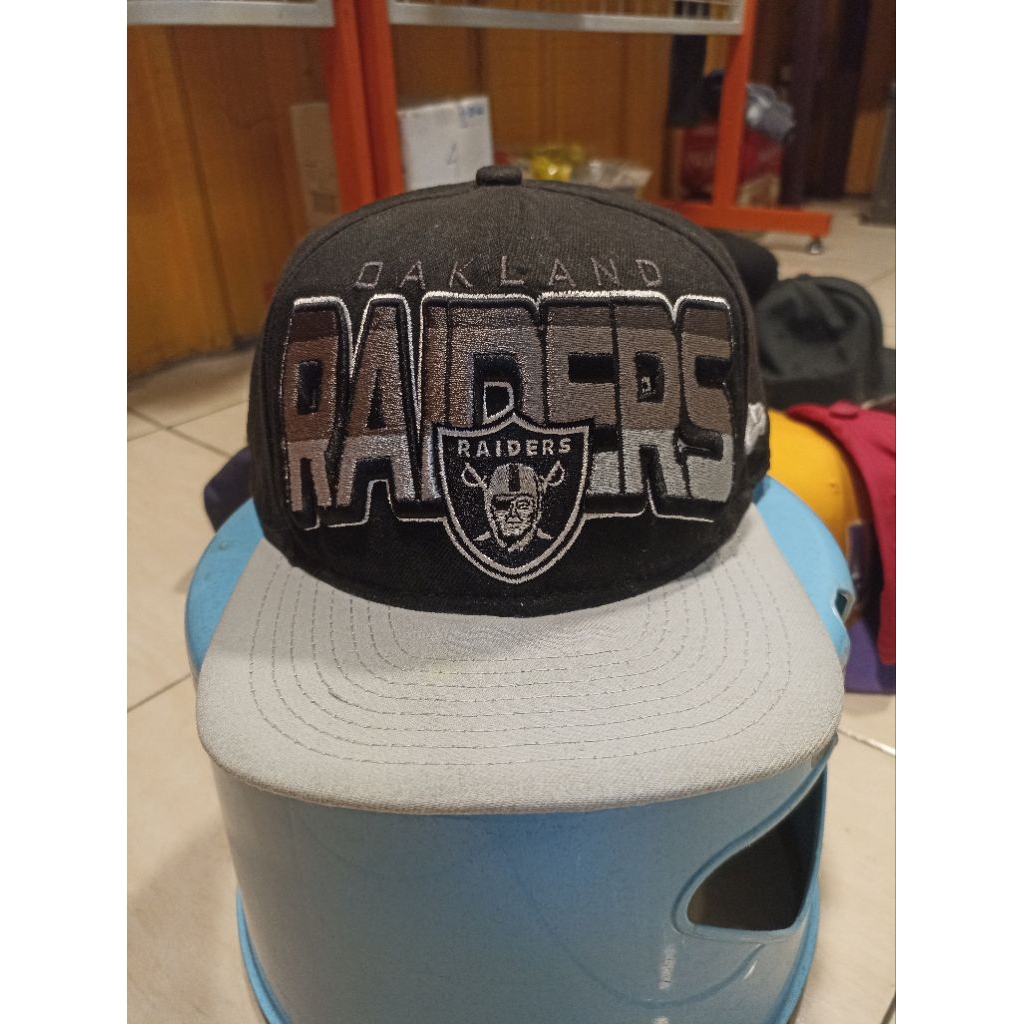 topi new era rai ders ori