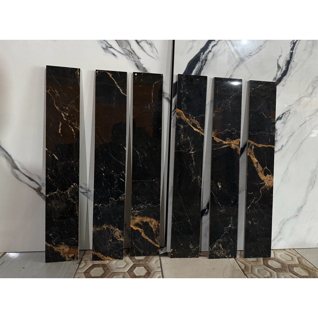 plin granit 10x60 corak marmer hitam emas