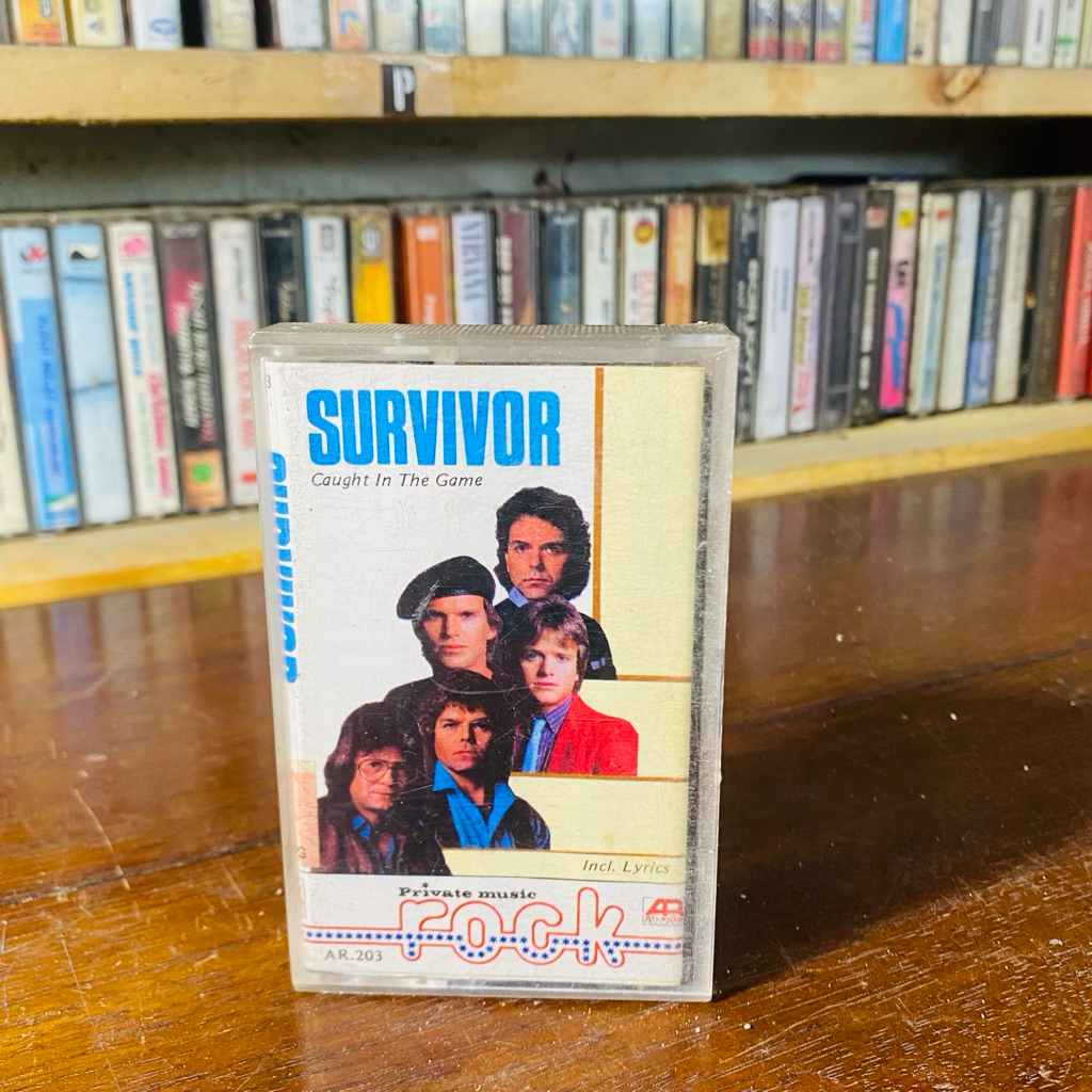 KASET PITA SURVIVOR - CAUGHT IN THE GAME - PRIVATE MUSIC ROCK