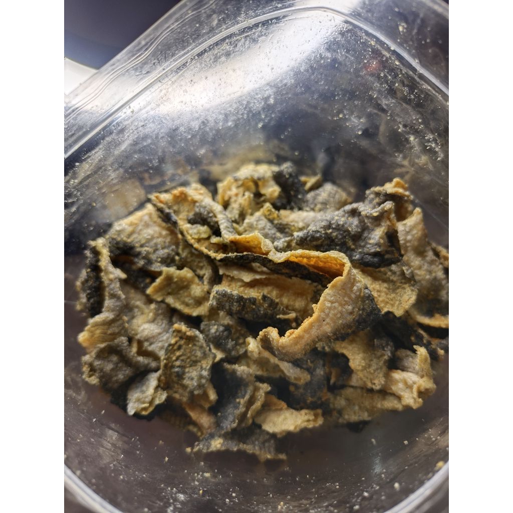 

KERIPIK KULIT IKAN PATIN VARIAN ORIGINAl GURIH KRIUKK UKURAN 100 GRAMKripik Kulit Ikan Patin100 Gram