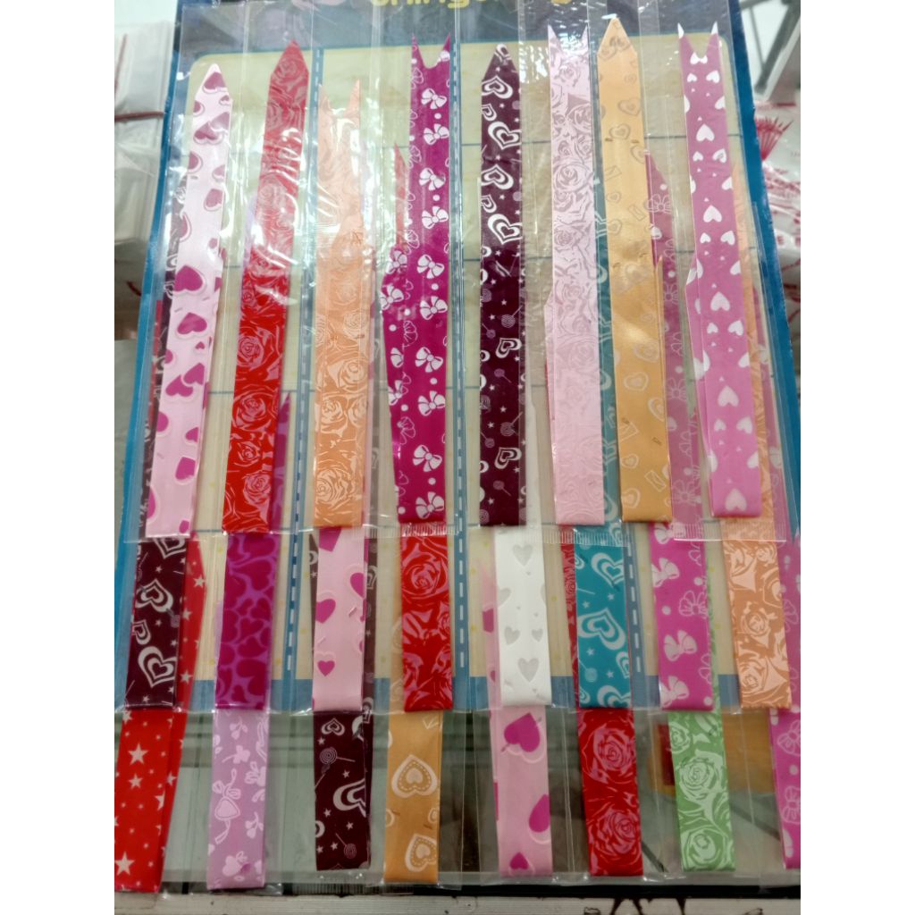 

Pita serut sedang ( perpack isi 24, warna random) | pita tarik