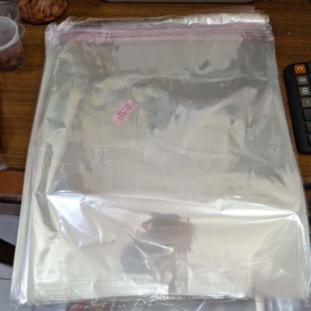 

plastik opp baju / plastik baju lem ukuran 35 x 40