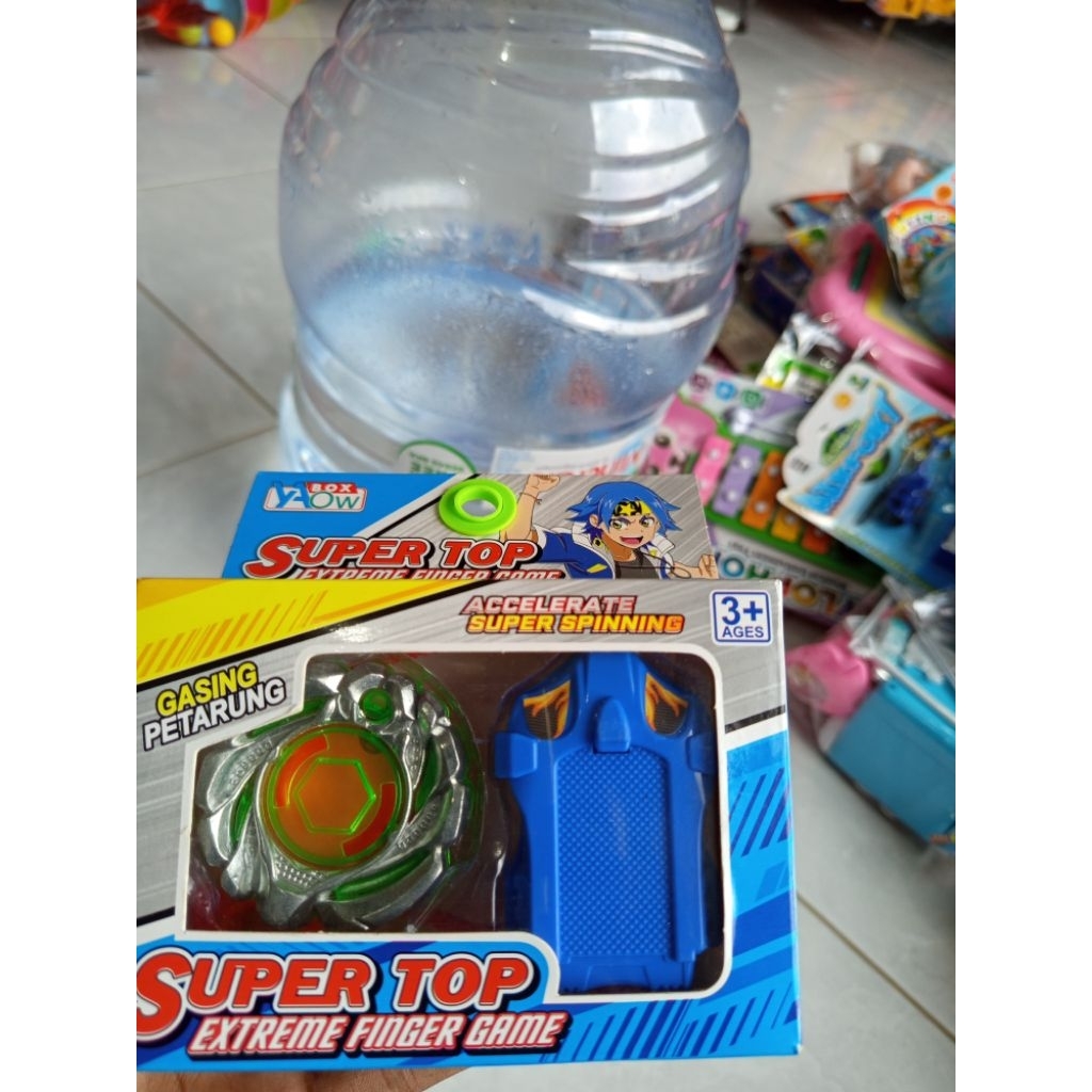 mainan gasing tarik