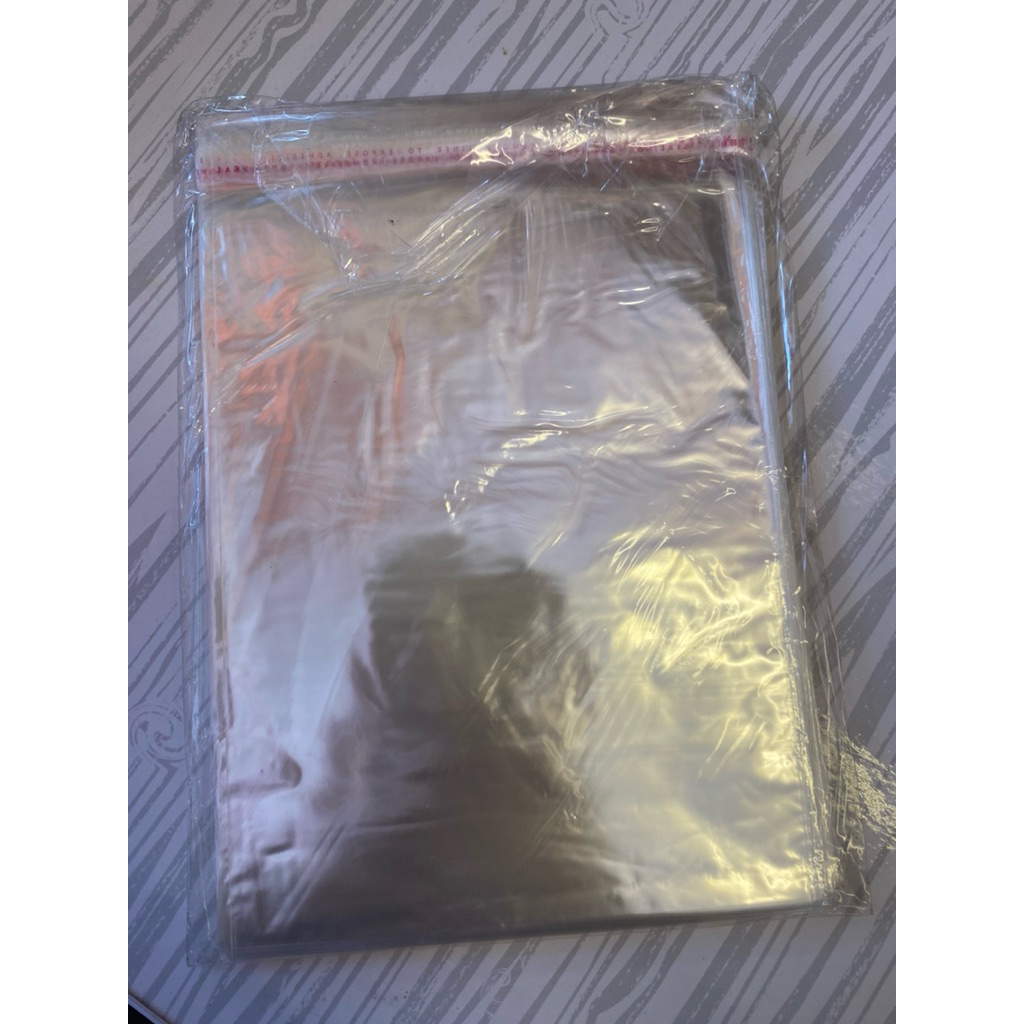 

plastik opp isi 100 lembar uk 14x22 cm