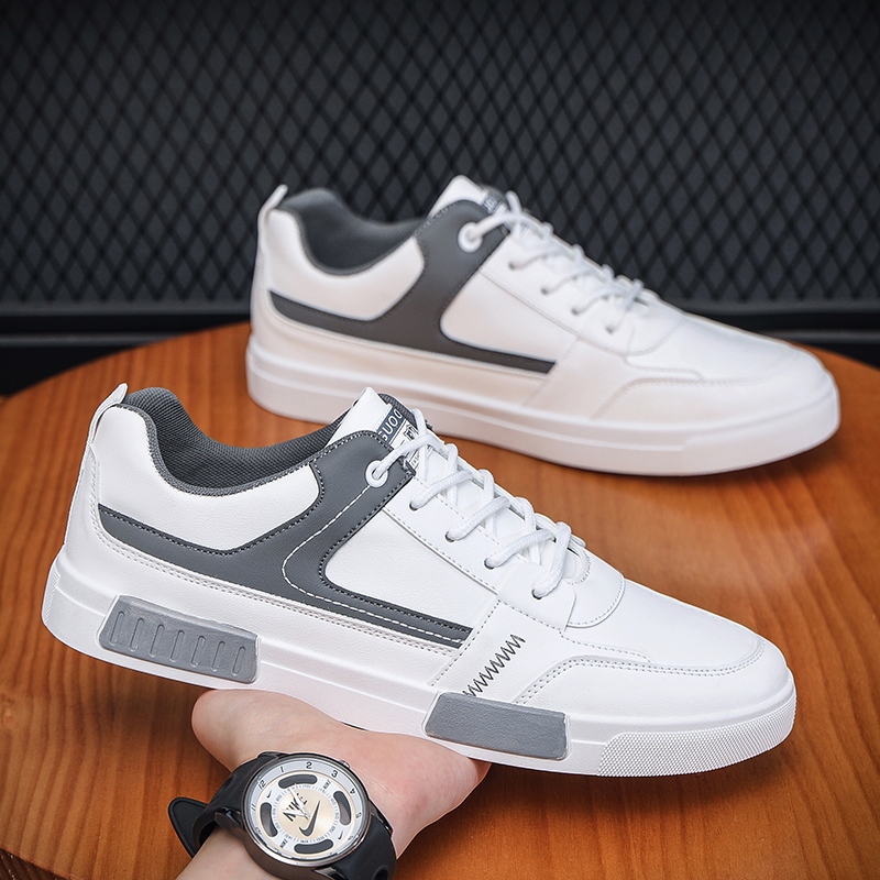 Sepatu kets pria kulit putih sepatu kerja kasual sepatu putih pria mode perguruan tinggi