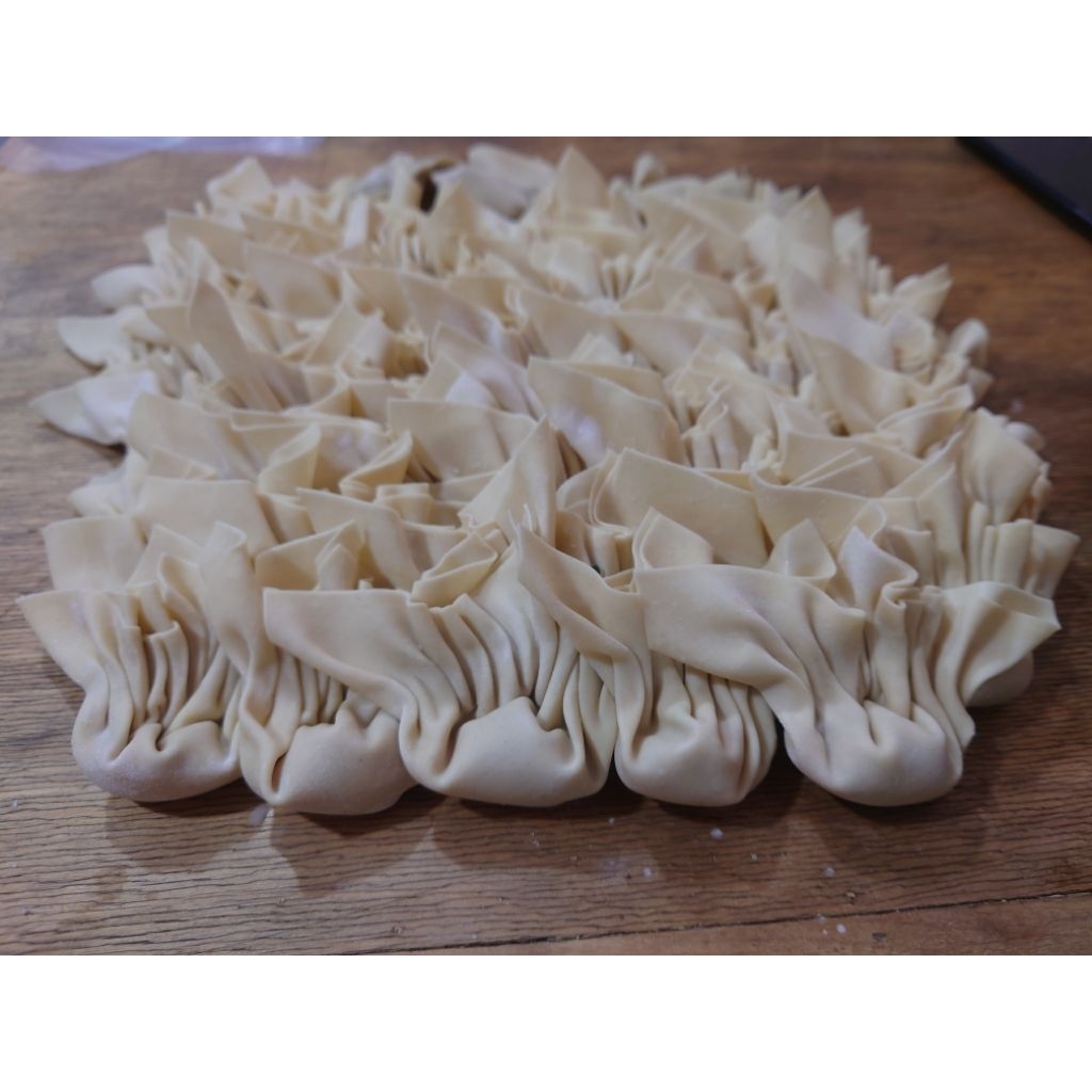 

pangsit mentah rebus/goreng per biji