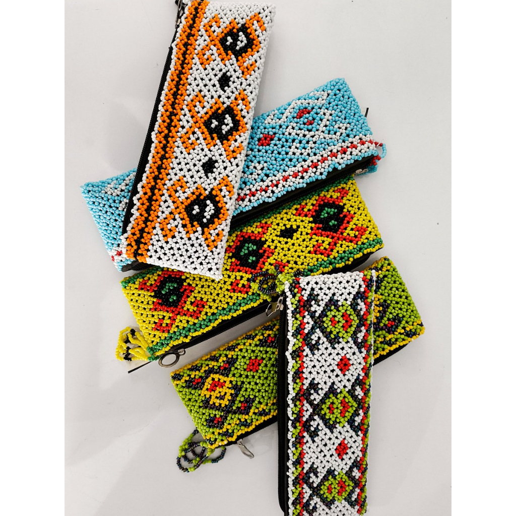 

Dompet Pencil Motif Manik Dayak