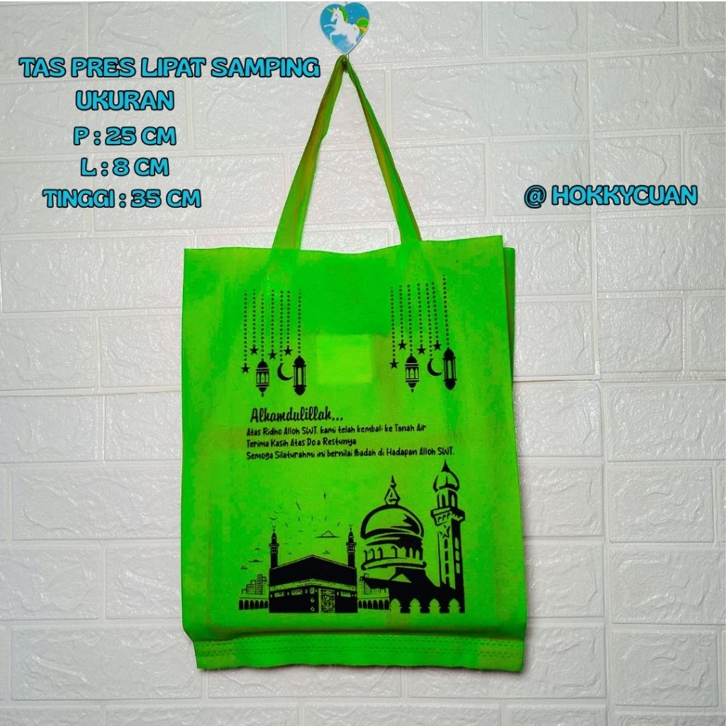 

Tas oleh oleh haji dan umroh sablon//25cm x 8cm x 35cm//tas spunbond//1 lusin isi 12pcs