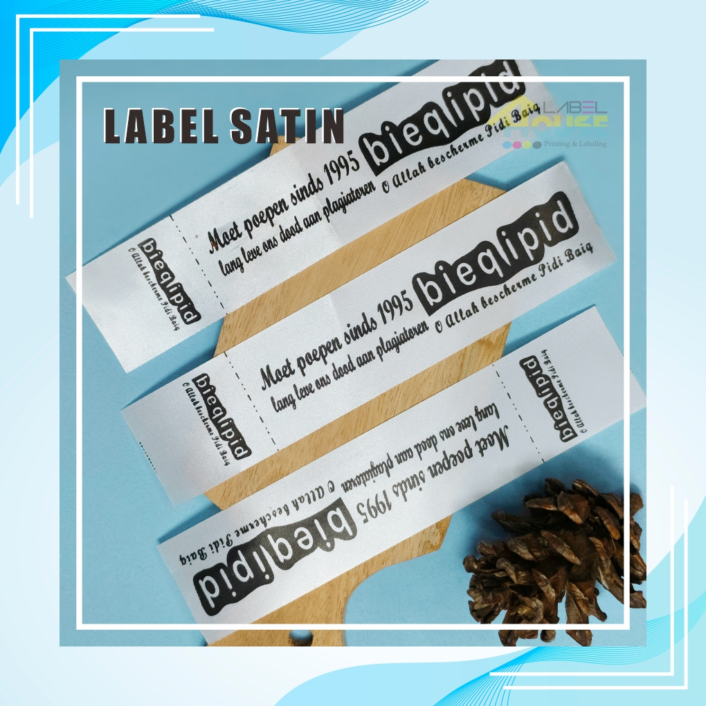 

Label Baju Pita Satin Putih | Merek & Label Washing | Label Baju Printing Custom Design