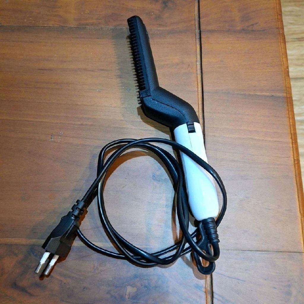 sisir pelurus rambut elektrik