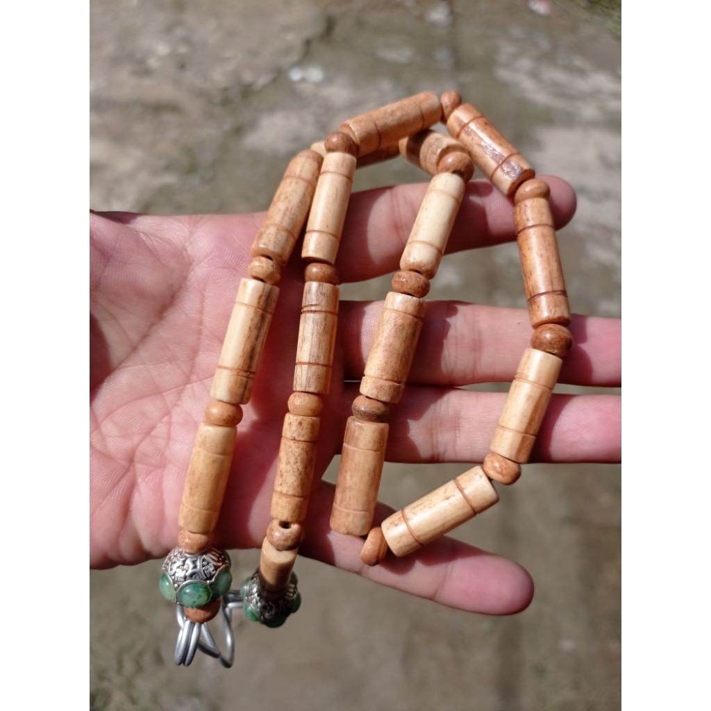 kalung Tulang HM bentuk tabung